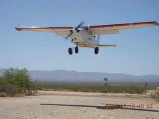 98 77a. Alamo Lake airstrip - landing airplane