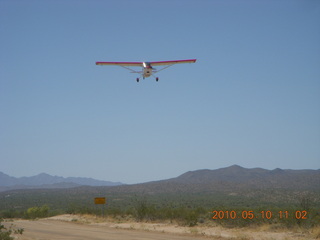 107 77a. Alamo Lake airstrip - landing airplane