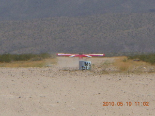 110 77a. Alamo Lake airstrip - landing airplane