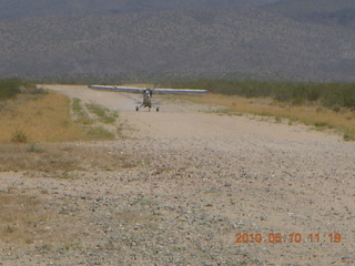 133 77a. Alamo Lake airstrip - landing airplane