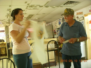 153 77a. Alamo Lake airstrip - Wayside Inn - Nancy giving Carl t-shirt