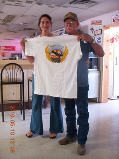 155 77a. Alamo Lake airstrip - Wayside Inn - Nancy giving Carl t-shirt