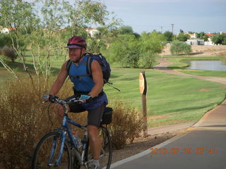 Adam riding bicycle on Green Belt in Scottsdale