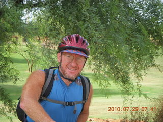 Adam riding bicycle on Green Belt in Scottsdale