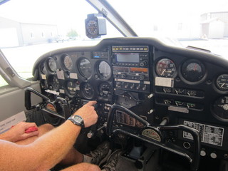 10 7b3. Adam's hands on N8377W controls, plus instruments