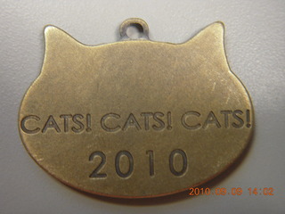 Sean's cat medallion from Burning Man