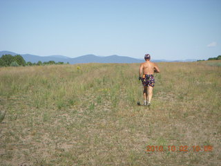 1311 7c2. Adam running at Me-Own airstrip (with SPOT on the belt strap) - back