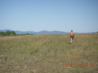 Adam running at Me-Own airstrip (with SPOT on the belt strap) - back