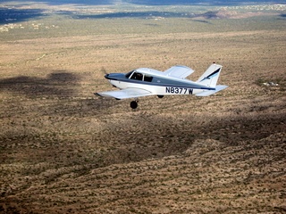 241 7ej. Sean picture - aerial - N8377W in flight