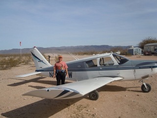 291 7g6. Antoine's pictures - Adam and N8377W at Alamo Lake airstrip