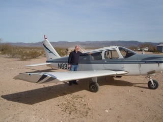 294 7g6. Antoine's pictures - Antoine and N8377W at Alamo Lake airstrip