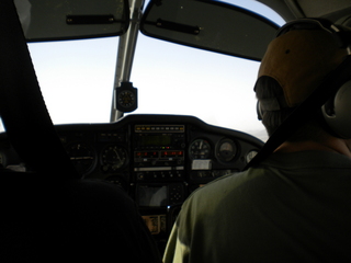 338 7g8. Sky Harbor fly-in - silhouette flying N8377W