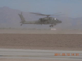 Apache helicopter flying at Gateway Airport (IWA)