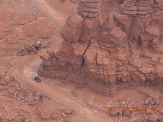 Anticline Overlook - someone driving on dirt road below