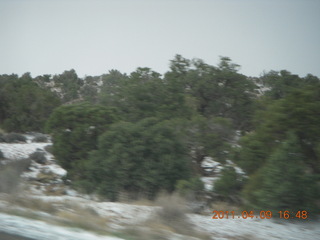 313 7j9. drive back from Dead Horse Point to Moab - hail (or something harder then rain or snow) on side of road