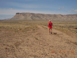 72 7qa. Sand Wash airstrip - Adam running - back (tripod)