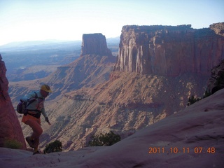 42 7qb. Canyonlands National Park - Lathrop trail hike - Adam hiking (tripod)