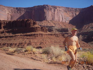 80 7qb. Canyonlands National Park - Lathrop trail hike - Adam running (tripod)