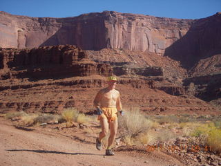 81 7qb. Canyonlands National Park - Lathrop trail hike - Adam running (tripod)