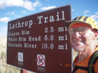 224 7qb. Canyonlands National Park - Lathrop trail hike - Adam and sign