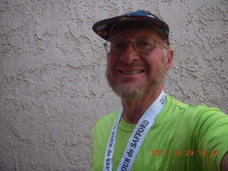 Adam with shirt and medal from Safford half-marathon race