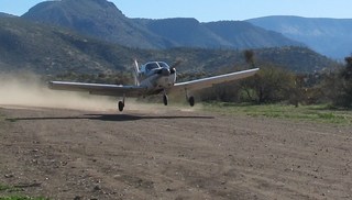 738 7u8. N8377W taking off at Bouquet Ranch