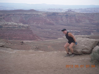 77 7x1. Canyonlands Murphy hike - Adam sitting down (tripod)
