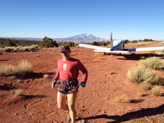 959 7zl. Tony's picture of N8377W at Nokai Dome airstrip with Adam running