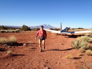 1845 7zl. Tony's picture of N8377W at Nokai Dome airstrip with Adam running