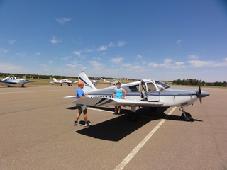 Tony's picture of N8377W at Nokai Dome airstrip with Adam running