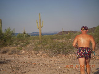 Adam running at Windmill airstrip (tripod, back)