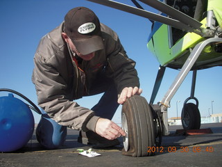 fixing a valve for Larry S's flat tire at Gallup (GUP)