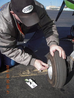 fixing a valve for Larry S's flat tire at Gallup (GUP)