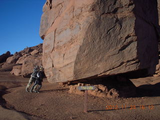 155 83q. Monument Valley tour - Sean and Kristina holding up cube rock