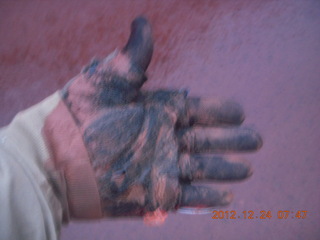 my muddy hand after cleaning up rocks from road