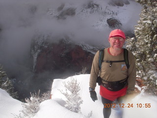 Zion National Park - cloudy, foggy Observation Point hike - Adam at the top