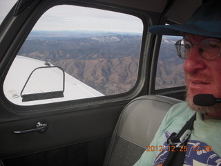 Adam flying over mountains