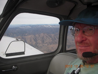 Adam flying over mountains