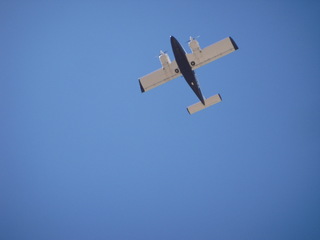 Kearny Airport (E67) - Rich's twin-engine airplane flying (seen from below)