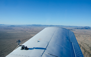 1140 87b. Yaseen's pictures - Adam's video camera on the wing of N8377W