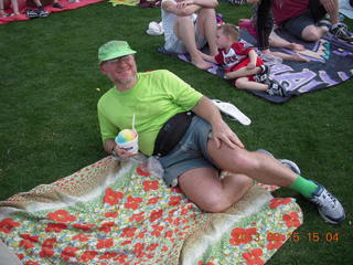 Adam watching baseball game with rainbow ice cone