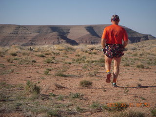 123 87y. Adam running at Grand Gulch (tripod and timer)