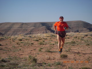 126 87y. Adam running at Grand Gulch (tripod and timer)