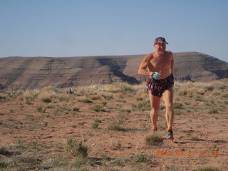 127 87y. Adam running at Grand Gulch (tripod and timer)