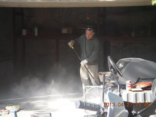 Ivan sweeping dusty garage