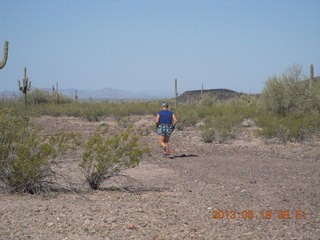 Adam running at Windmill airstrip (tripod, back)