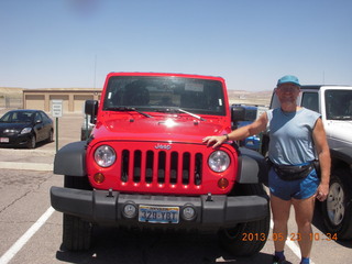 45 89p. Adam and red Jeep