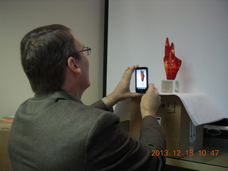 Jim S taking a picture of the Arizona Innovation Challenge award