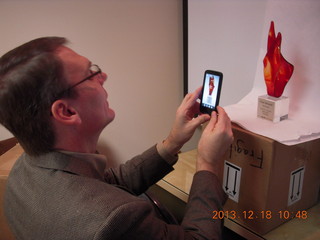 Jim taking a picture of the Arizona Innovation Challenge award