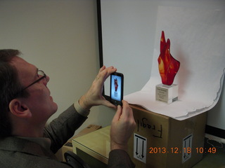 Jim taking a picture of the Arizona Innovation Challenge award